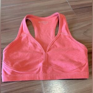 Beyond Yoga Space Dye Lift Your Spirits Bra in Coral Glow Heather.